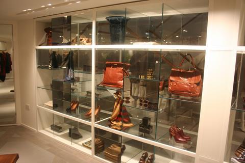 Glass niches show off the shoes and handbags to great effect